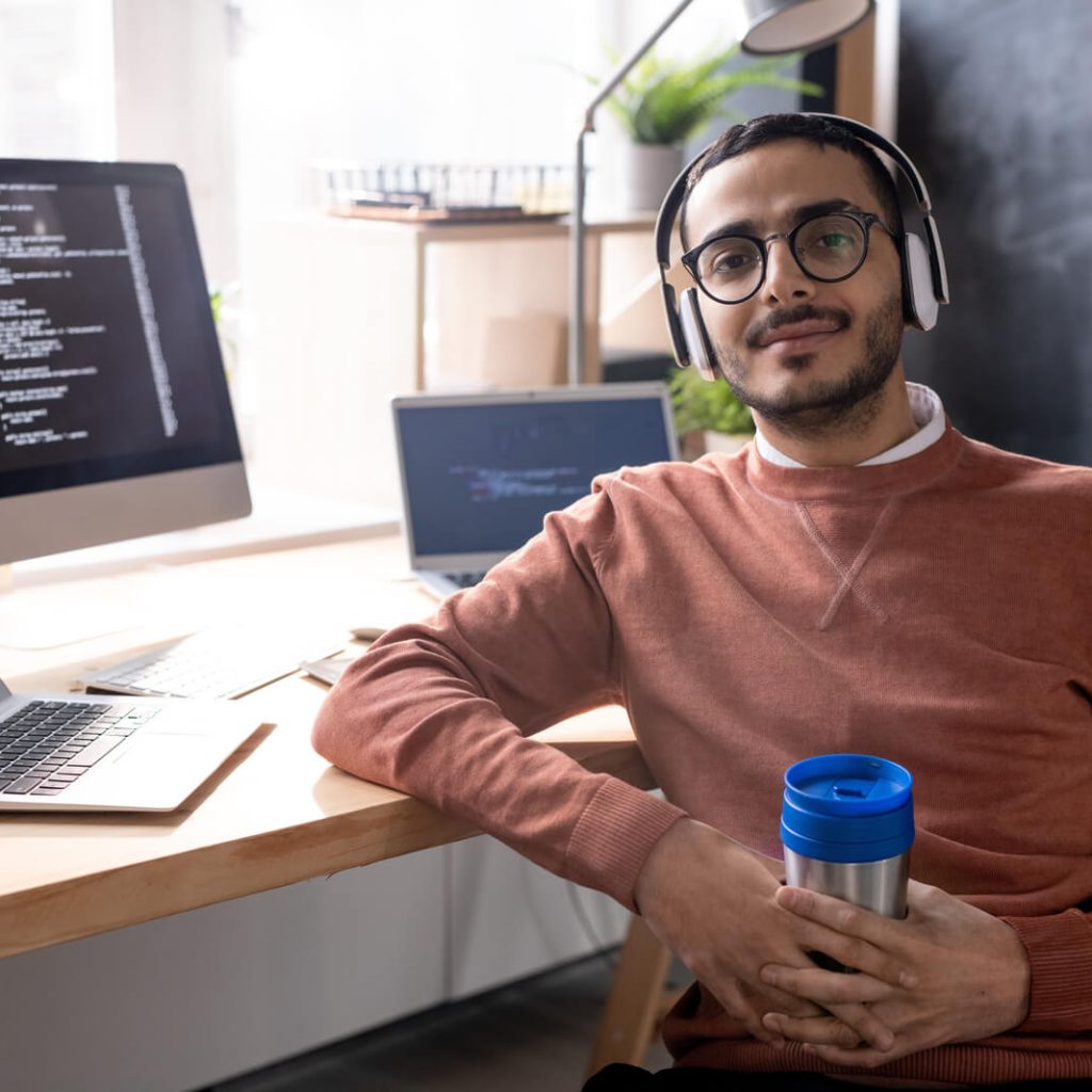 E-commerce web development: building online stores that sell. Handsome Programmer In Headphones Listening To Mus 2023 11 27 04 56 48 Utc 1024x1024
